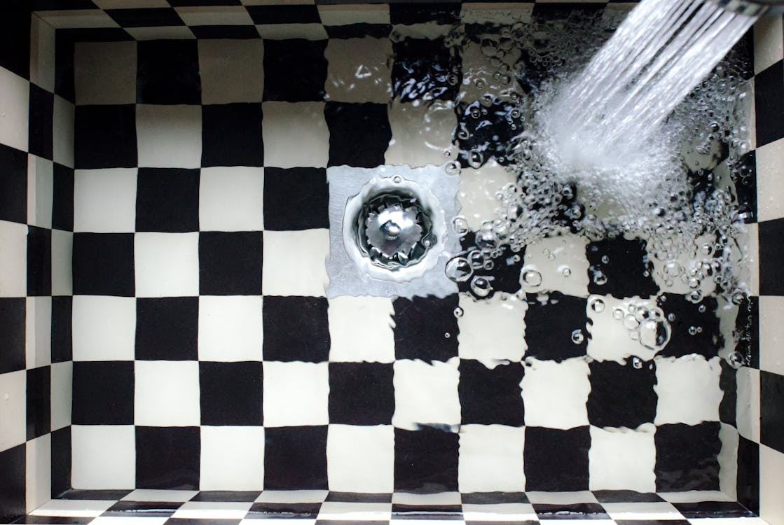 Water flooding a sink with a clogged drain