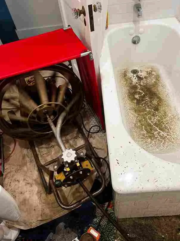 Severe Blockage in Main Drain Line Causing Tub to Back Up